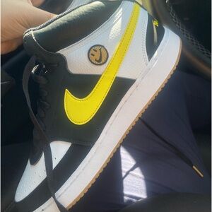 Black and White Nike “Courts Vision Mid” with yellow design.